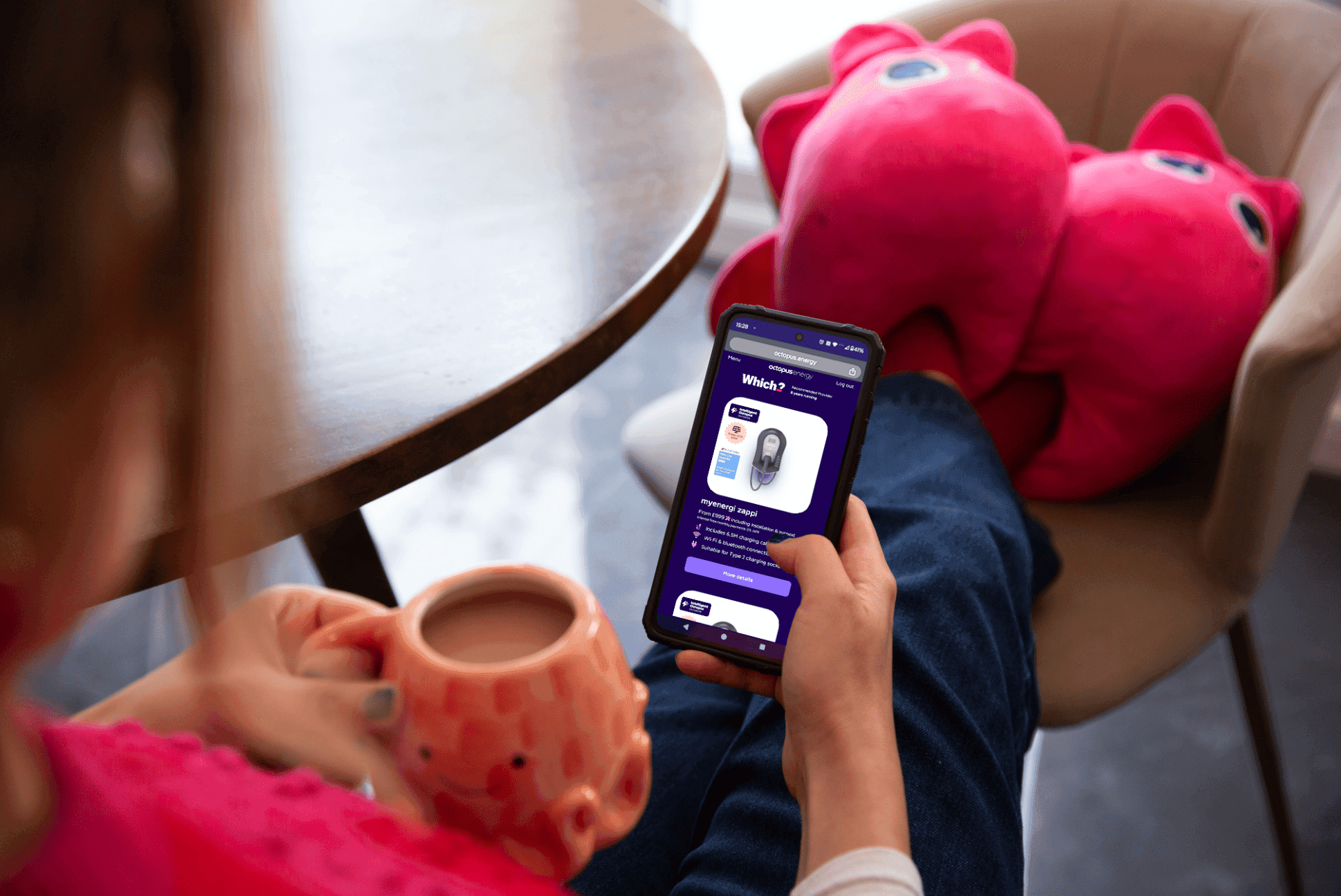 Image for step Customer with phone looking at EV chargers